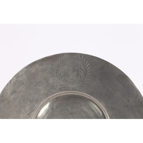 128 - A LATE 17TH CENTURY PEWTER BROAD RIM PLATE, SWISS. The rim with engraved mantled crest, opposed by t... 