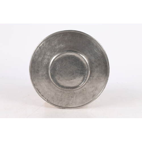 128 - A LATE 17TH CENTURY PEWTER BROAD RIM PLATE, SWISS. The rim with engraved mantled crest, opposed by t... 