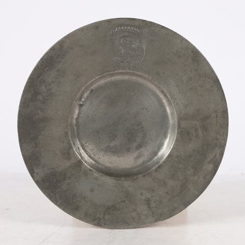 130 - A 17TH CENTURY PEWTER BROAD RIM PLATE, EUROPEAN. The rim stamped with a large coronet topped coat of... 