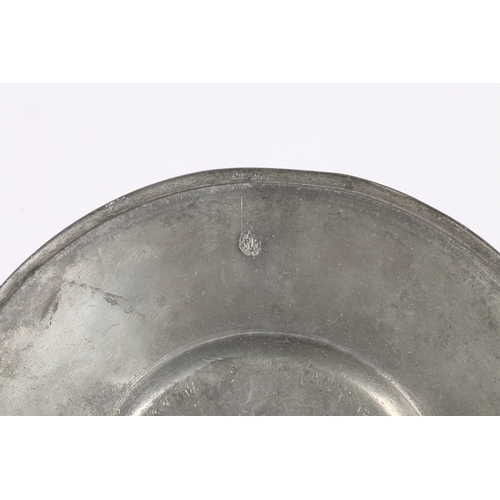 130 - A 17TH CENTURY PEWTER BROAD RIM PLATE, EUROPEAN. The rim stamped with a large coronet topped coat of... 