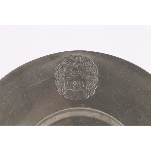 131 - A LATE 17TH CENTURY PEWTER BROAD-RIM PLATE, EUROPEAN. The rim stamped with a mantled heraldic device... 