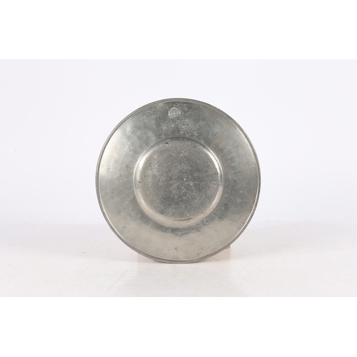 131 - A LATE 17TH CENTURY PEWTER BROAD-RIM PLATE, EUROPEAN. The rim stamped with a mantled heraldic device... 