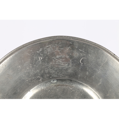 131 - A LATE 17TH CENTURY PEWTER BROAD-RIM PLATE, EUROPEAN. The rim stamped with a mantled heraldic device... 