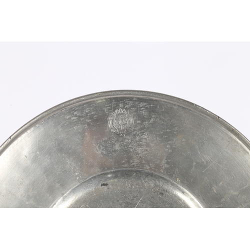 131 - A LATE 17TH CENTURY PEWTER BROAD-RIM PLATE, EUROPEAN. The rim stamped with a mantled heraldic device... 