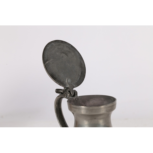 136 - A GEORGE III PEWTER NEW HALF-PINT BUD BALUSTER MEASURE. CIRCA 1780. The slender body with three deco... 