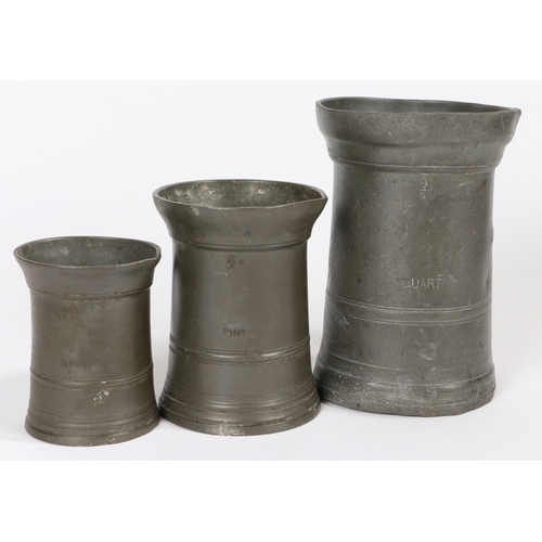 17 - A GEORGE III PEWTER OEWS QUART STRAIGHT-SIDED MUG, CONVERTED TO IMPERIAL CAPACITY BY EXTENDING THE L... 