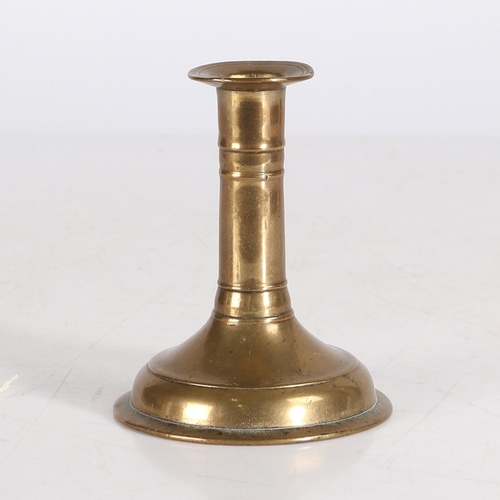 177 - A GOOD AND SMALL WILLIAM & MARY BRASS TRUMPET BASE CANDLESTICK, CIRCA 1690. With flared socket flang... 