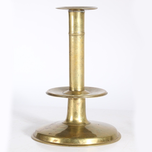 182 - AN EXCEPTIONAL AND UNUSUALLY LARGE MID-17TH CENTURY BRASS TRUMPET-BASE CANDLESTICK, ENGLISH, CIRCA 1... 