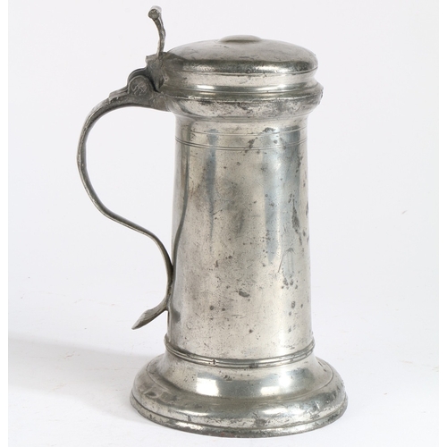 27 - A CHARLES I PEWTER FLAGON, CIRCA 1640. Having a tapering straight-sided drum with paired incised lin... 