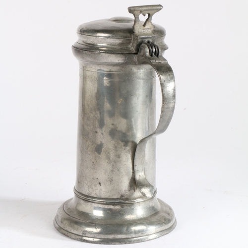 27 - A CHARLES I PEWTER FLAGON, CIRCA 1640. Having a tapering straight-sided drum with paired incised lin... 