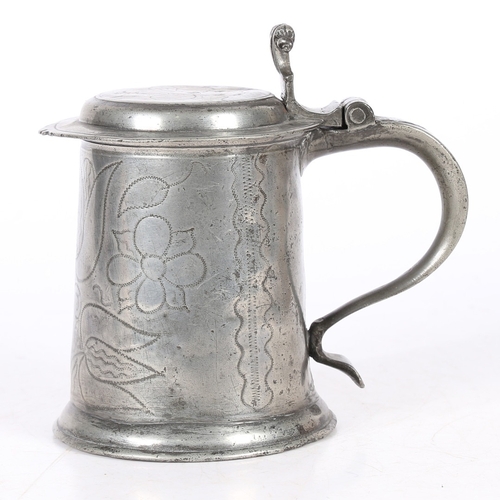 34 - A CHARLES II PEWTER WRIGGLEWORK FLAT-LID TANKARD, WIGAN, CIRCA 1680. The lid with front denticulatio... 