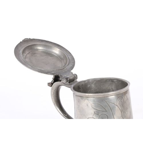 34 - A CHARLES II PEWTER WRIGGLEWORK FLAT-LID TANKARD, WIGAN, CIRCA 1680. The lid with front denticulatio... 