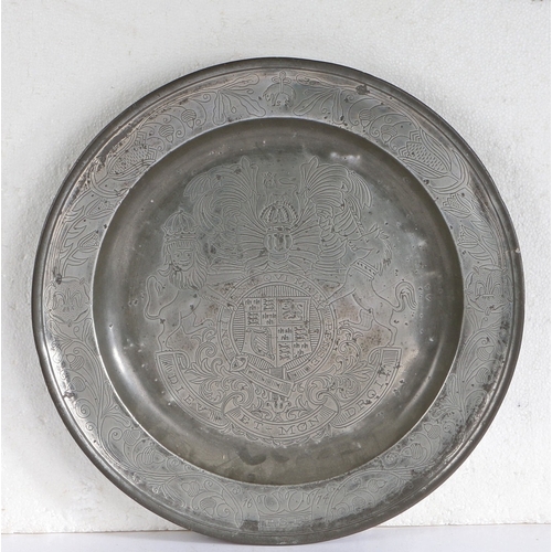 37 - A CHARLES II PEWTER SINGLE REED AND WRIGGLEWORK DECORATED DISH, YORKSHIRE, DATED 1674. The well desi... 