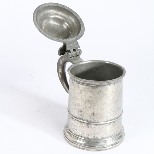 4 - A GEORGE I PEWTER OEWS QUART DOMED-LIDDED STRAIGHT-SIDED TANKARD, CIRCA 1720. The drum with low slen... 