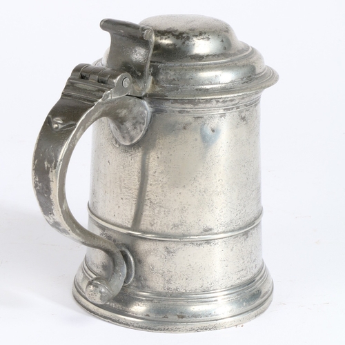 4 - A GEORGE I PEWTER OEWS QUART DOMED-LIDDED STRAIGHT-SIDED TANKARD, CIRCA 1720. The drum with low slen... 