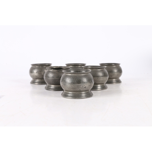 41 - A RARE SET OF SIX EARLY 19TH CENTURY PEWTER BULBOUS SALTS, ENGLISH, CIRCA 1830. Each with a beaded c... 