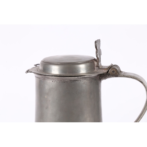 46 - A WILLIAM & MARY PEWTER FLAT-LID FLAGON, YORK, CIRCA 1690. Having a plain straight-sided and taperin... 