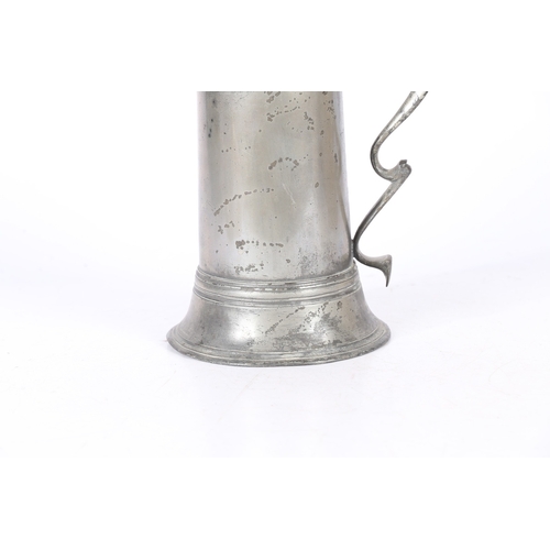 49 - A GEORGE II PEWTER SPIRE FLAGON, CIRCA 1720-50. The tapering drum with high fillet and flared skirt ... 