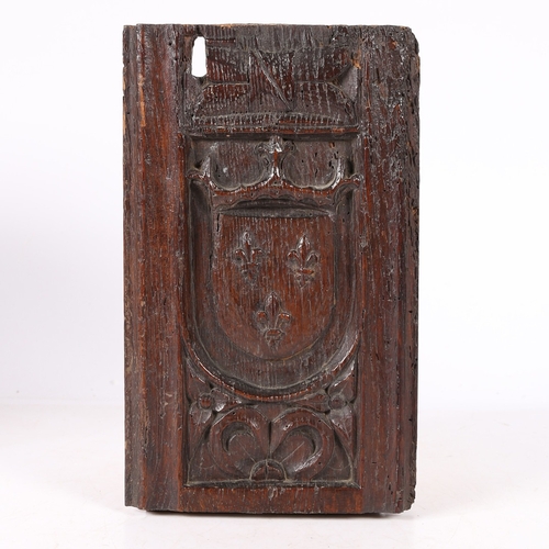 515 - AN EARLY 16TH CENTURY CARVED OAK ROYAL ARMORIAL PANEL, CIRCA 1500-20. Designed with the arms of the ... 