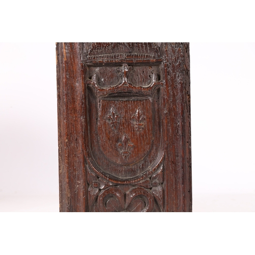 515 - AN EARLY 16TH CENTURY CARVED OAK ROYAL ARMORIAL PANEL, CIRCA 1500-20. Designed with the arms of the ... 