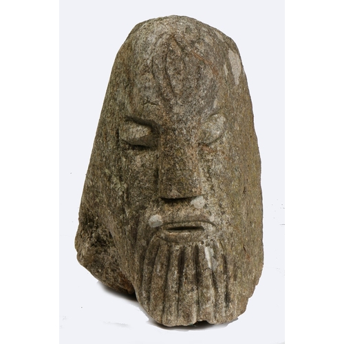 528 - AN ANTIQUE CARVED HEAD IN THE CELTIC MANNER. carved with a beard, 39.5cm high, 24cm wide,  49cm deep... 