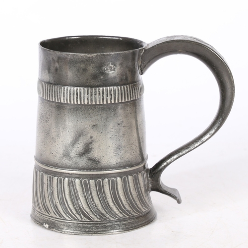 55 - A RARE WILLIAM & MARY PEWTER GADROONED PINT MUG, CIRCA 1700-02. The tapering straight-sided body wit... 
