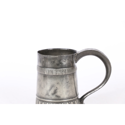 55 - A RARE WILLIAM & MARY PEWTER GADROONED PINT MUG, CIRCA 1700-02. The tapering straight-sided body wit... 