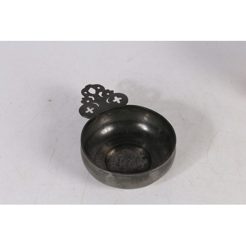 58 - A WILLIAM & MARY PEWTER PORRINGER, CIRCA 1690. Having a geometric-pierced cartouche ear, stamped wit... 