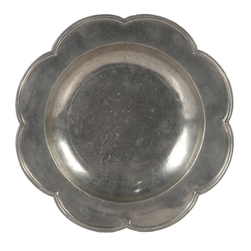 61 - A RARE SHAPED GEORGE II PEWTER DISH, CIRCA 1750. The eight-lobed rim with applied double-reeded edge... 