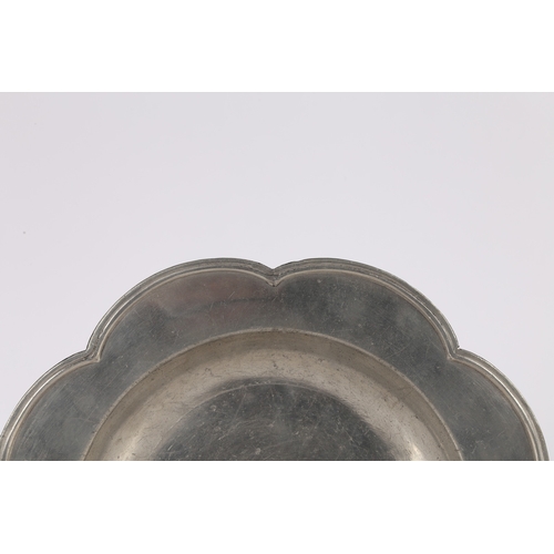 61 - A RARE SHAPED GEORGE II PEWTER DISH, CIRCA 1750. The eight-lobed rim with applied double-reeded edge... 