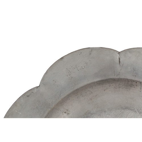 61 - A RARE SHAPED GEORGE II PEWTER DISH, CIRCA 1750. The eight-lobed rim with applied double-reeded edge... 