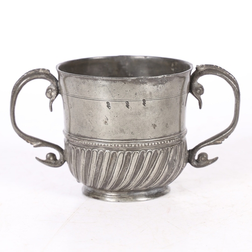 62 - A RARE AND FINE QUEEN ANNE PEWTER TWIN-HANDLED GADROONED CUP, WIGAN, CIRCA 1705. The cup with plain ... 