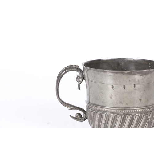 62 - A RARE AND FINE QUEEN ANNE PEWTER TWIN-HANDLED GADROONED CUP, WIGAN, CIRCA 1705. The cup with plain ... 