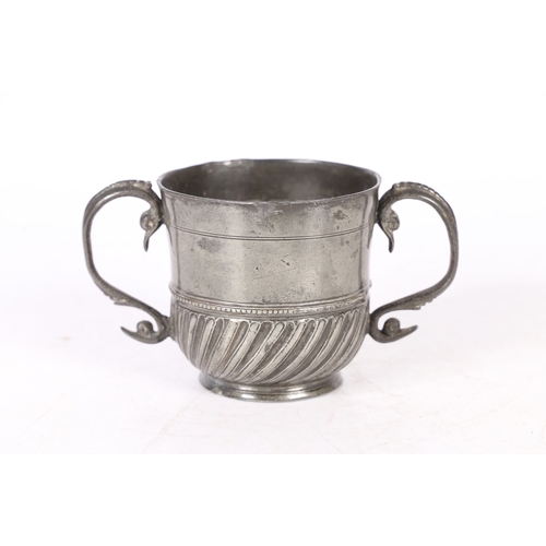 62 - A RARE AND FINE QUEEN ANNE PEWTER TWIN-HANDLED GADROONED CUP, WIGAN, CIRCA 1705. The cup with plain ... 