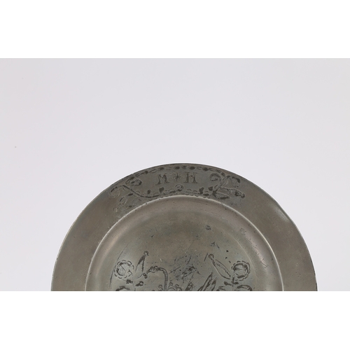 63 - A GEORGE III PEWTER ENGRAVED PLAIN RIM PLATE, CIRCA 1780. The well designed with an enchained swan d... 