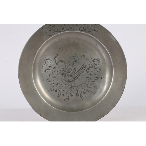 63 - A GEORGE III PEWTER ENGRAVED PLAIN RIM PLATE, CIRCA 1780. The well designed with an enchained swan d... 