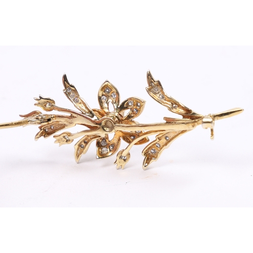 16 - AN 18 CARAT GOLD AND DIAMOND BROOCH. in the form of a flowering branch, the central diamond measurin... 