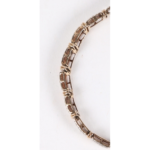 17 - A 9 CARAT GOLD AND DIAMOND BRACELET. formed from nineteen rectangular panels each set with twenty ro... 