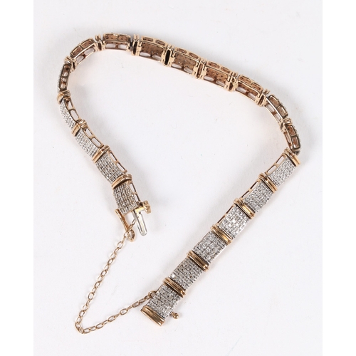 17 - A 9 CARAT GOLD AND DIAMOND BRACELET. formed from nineteen rectangular panels each set with twenty ro... 