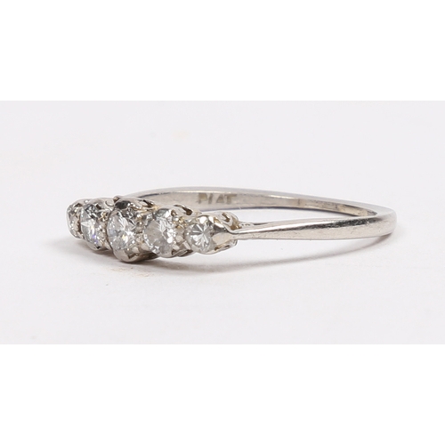 18 - A PLATINUM AND DIAMOND RING. the head set with five graduated circular diamonds, approximately 0.40c... 