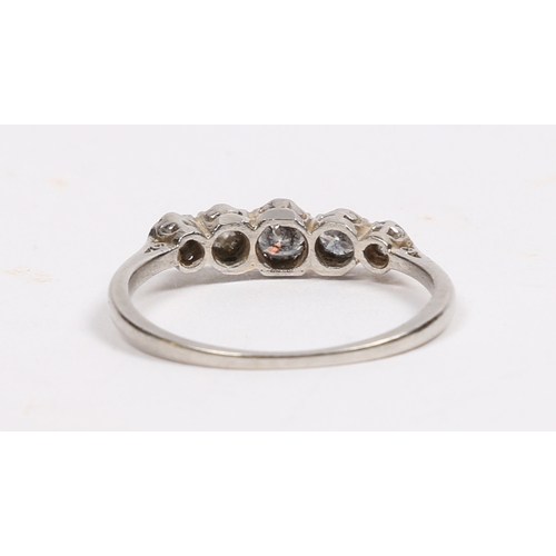 18 - A PLATINUM AND DIAMOND RING. the head set with five graduated circular diamonds, approximately 0.40c... 