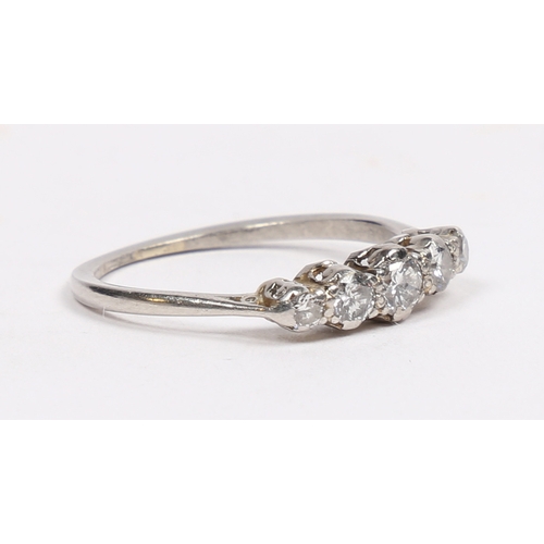 18 - A PLATINUM AND DIAMOND RING. the head set with five graduated circular diamonds, approximately 0.40c... 