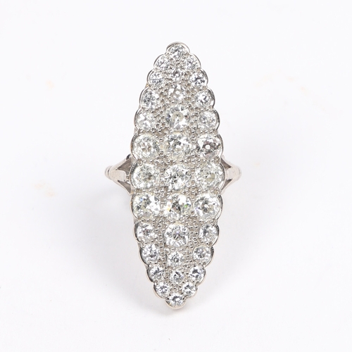 19 - AN 18 CARAT WHITE GOLD AND DIAMOND RING. the navette form head set with an arrangement of 33 diamond... 