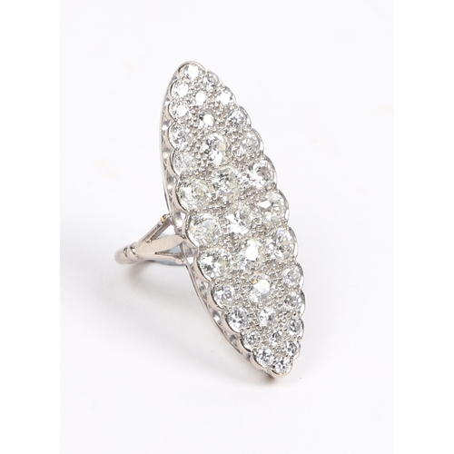 19 - AN 18 CARAT WHITE GOLD AND DIAMOND RING. the navette form head set with an arrangement of 33 diamond... 