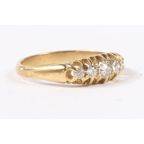 2 - AN 18 CARAT GOLD AND DIAMOND RING. the head set with five graduated round cut diamonds, ring size N,... 