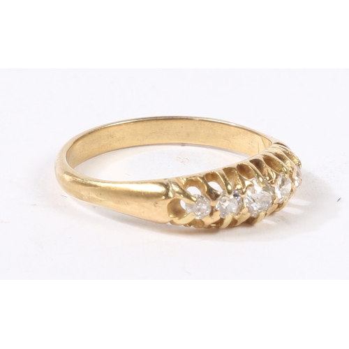 2 - AN 18 CARAT GOLD AND DIAMOND RING. the head set with five graduated round cut diamonds, ring size N,... 