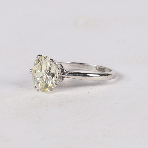 24 - AN IMPRESSIVE DIAMOND AND PLATINUM SOLITAIRE RING. the circular brilliant cut diamond weighing 3.60c... 