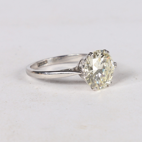 24 - AN IMPRESSIVE DIAMOND AND PLATINUM SOLITAIRE RING. the circular brilliant cut diamond weighing 3.60c... 