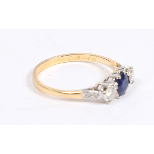 27 - A YELLOW METAL, SAPPHIRE AND DIAMOND RING. the head with a central sapphire flanked by two diamonds ... 