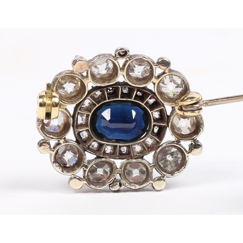 29 - AN EARLY 19TH CENTURY SAPPHIRE AND DIAMOND BROOCH. the central oval facet cut sapphire surrounded by... 